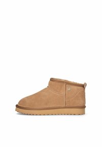 Stivaletti alla caviglia in suede marrone con un morbido rivestimento interno, tacco basso, punta arrotondata e una linguetta a ciclo sul retro. Suola in gomma spessa.