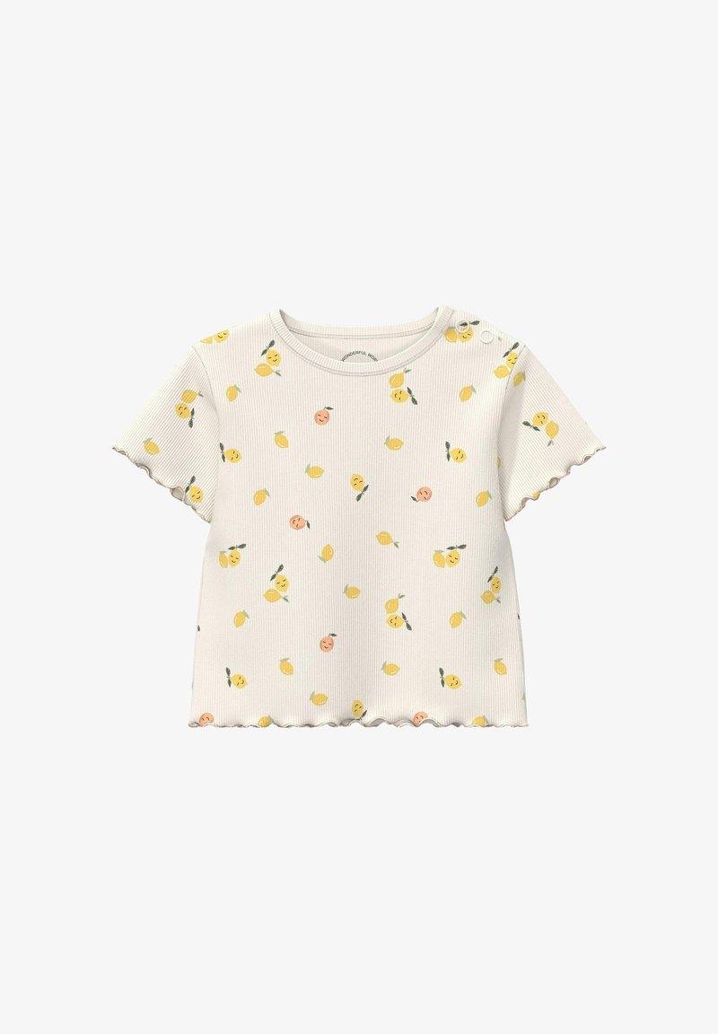 Chemise à manches courtes côtelée de couleur crème pour tout-petit, ornée de motifs de fruits souriants jaunes et pêche, avec des boutons sur une épaule.