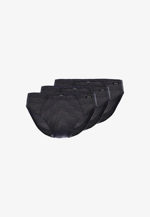 Trois slips noirs pour hommes avec un motif en chevrons, fabriqués en tissu doux. Chacun possède une ceinture lisse et un branding subtil.