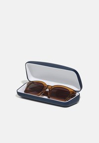 Lacoste Óculos de sol - transparent caramel