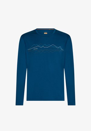 Sininen pitkähihaisen pyöreäkauluksinen paita, jossa abstrakti vuorilinjan kuvio ja rinnan kohdalla "icebreaker" -teksti.