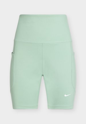 Shorts de sport taille haute vert clair avec poches latérales et logo Nike blanc sur la jambe gauche.