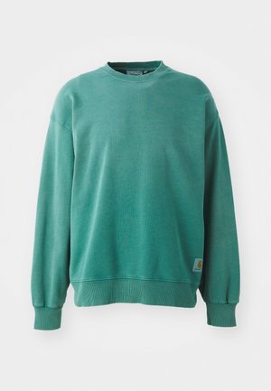 Žalias vyrų trumpo rankovio megztinis, pagamintas iš medvilnės mišinio. Su įaustiniais rankogaliais ir apačia, laisvas kirpimas ir mažas logotipo ženklelis apatinėje kairėje pusėje.