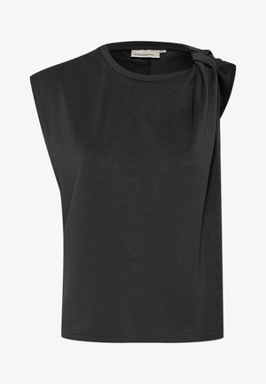Czarny top z krótkim rękawem o luźnym kroju, z węzełkiem na jednym ramieniu. Wykonany z gładkiego materiału o prostym designie.