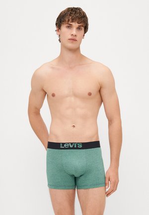 Zelené boxerky s texturou, které mají černý pas s logem "Levi's" v zelené barvě. Střih těsně přiléhající k tělu s tvarovanou přední kapsou.