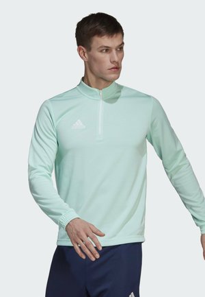Mint green, long-sleeve athletic top with a quarter-zip design, featuring a white Adidas logo on the left chest and ribbed cuff accents.