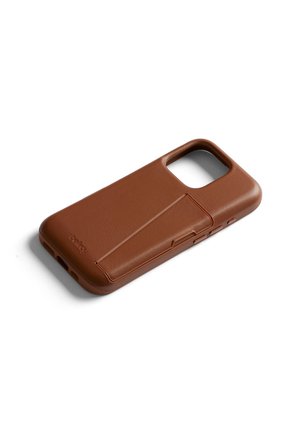 Brown leather smartphone case with cardholder slot and camera cutout, angled on white background.