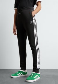 adidas Originals TREFOIL KIDS - Teplákové kalhoty - black