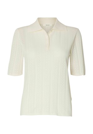 Polo en maille crème à manches courtes avec un motif délicat en dentelle verticale et un col, patte boutonnée au niveau de l'encolure.