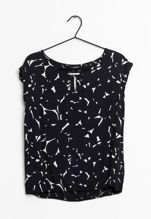 Black short-sleeve blouse with abstract white shapes, round neckline with small keyhole, hanging on black hanger against white background.