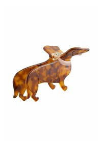 Sköldpaddsmönstrad harts hundformad hårklipp med två stiliserade taxfigurer. Slät yta med tydliga konturer av kropp och öron.