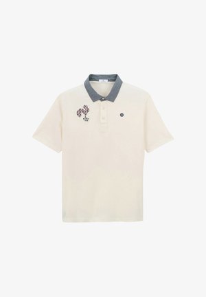 Cream polo shirt with grey collar, three buttons, floral squirrel graphic, and "Blanco 1958" text on left chest.