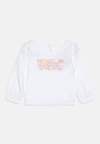 Camicia bianca in cotone a maniche lunghe con scollo rotondo, caratterizzata da una grafica colorata del logo Levi's e maniche a sbuffo con polsini elastici.