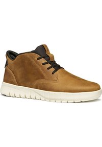 Brown leather ankle boots with a rounded toe, black laces, and a cream rubber sole featuring a textured pattern for grip.
