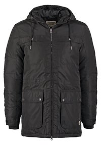 Svart vadderad jacka med dragkedja framtill, huva och två framfickor. Har tryckknappslås och en slät, texturerad tyg.