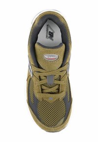 Green mesh and suede athletic shoe with gray accents, round toe, laces, and New Balance logo on tongue. Sole has cushioning grooves.