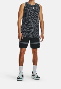 Black and gray sleeveless tank top with a zebra stripe pattern, paired with black shorts featuring gray horizontal stripes and white sneakers.
