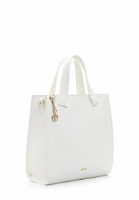 White textured leather handbag with double handles, gold circular charm, and small gold brand logo on front bottom right.