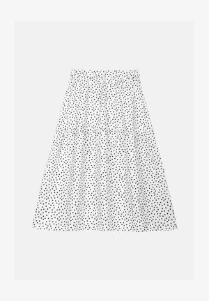 Saia branca com cintura franzida e bolinhas pretas, apresentando um design em camadas que adiciona volume e textura.