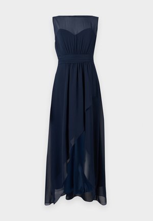 Tumedat sinine õhtukleit, ilma varrukateta ja südamekujuline kaelus. Voogav šifoonkangas, kogutud talje ja ebaühtlane hems.