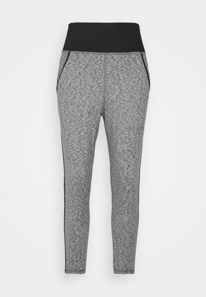 Pantalon gris chiné coupe slim avec une large ceinture élastique noire et des poches latérales, présenté sur un fond uni.