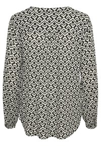 Blusa a maniche lunghe con un motivo geometrico in bianco e nero, dal taglio comodo e con dettagli di pieghe sulla schiena. Tessuto morbido.