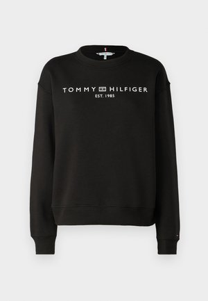 Musta collegepaita, joka on valmistettu puuvillasekoitteesta. Paidassa on pyöreä kaula-aukko, resorit hihoissa sekä valkoiset tekstit "TOMMY HILFIGER EST. 1985".