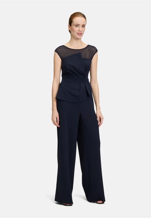 Navy-blaues Jumpsuit mit tailliertem Oberteil, durchsichtigen Tüllärmelchen und weit geschnittenen Hosenbeinen, ausgestattet mit einem Gürtel in der Taille und Faltendetails.