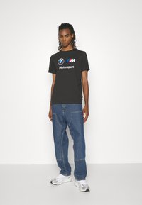 Puma LOGO TEE - Triko s potiskem - puma black