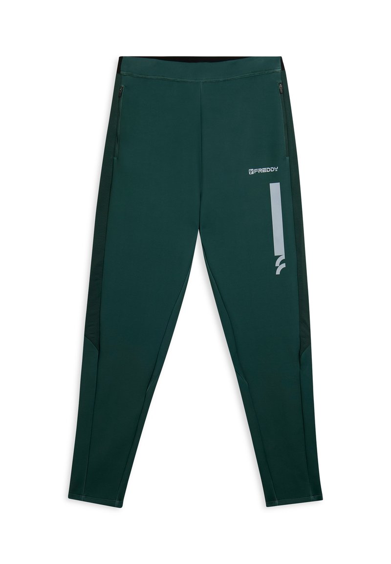 Pantalons de sport vert foncé avec une coupe ajustée, panneaux latéraux en mesh, poches zippées et un logo réfléchissant argenté à l'avant.