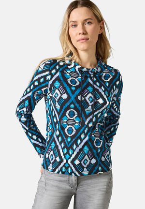 Haut à capuche à manches longues bleu et noir avec des motifs en losanges, cordon de serrage au cou et tissu doux et texturé.