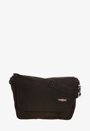 Black Eastpak messenger bag with adjustable strap, fold-over flap, and logo patch. Made of durable fabric with smooth texture.