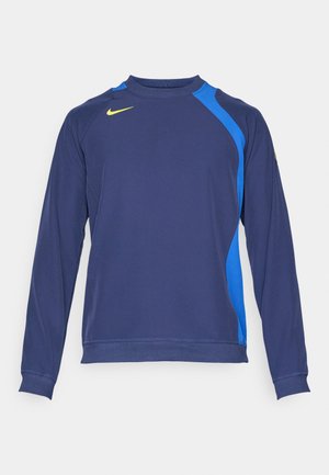 Maglietta atletica a maniche lunghe blu marino con pannelli laterali azzurri, scollatura rotonda e logo giallo sul petto. Realizzata in un tessuto morbido e elasticizzato.