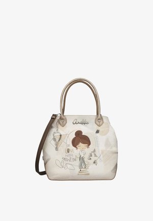 Borsa beige con manici marroni raffigurante una donna fumetto, libri e il testo "Innamorata della conoscenza" in scritta decorativa.