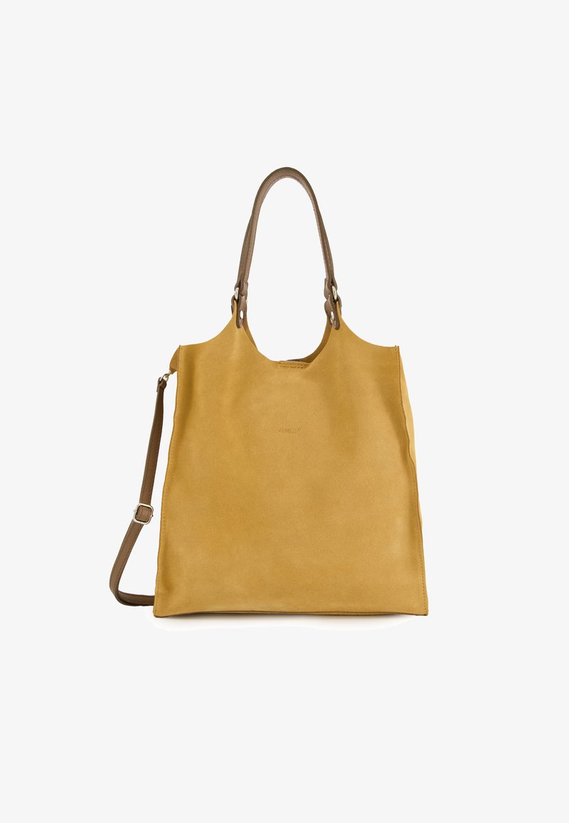 Leather tote bag in mustard yellow with a smooth texture, featuring dual handles and an adjustable shoulder strap. Minimalist design, no visible hardware.