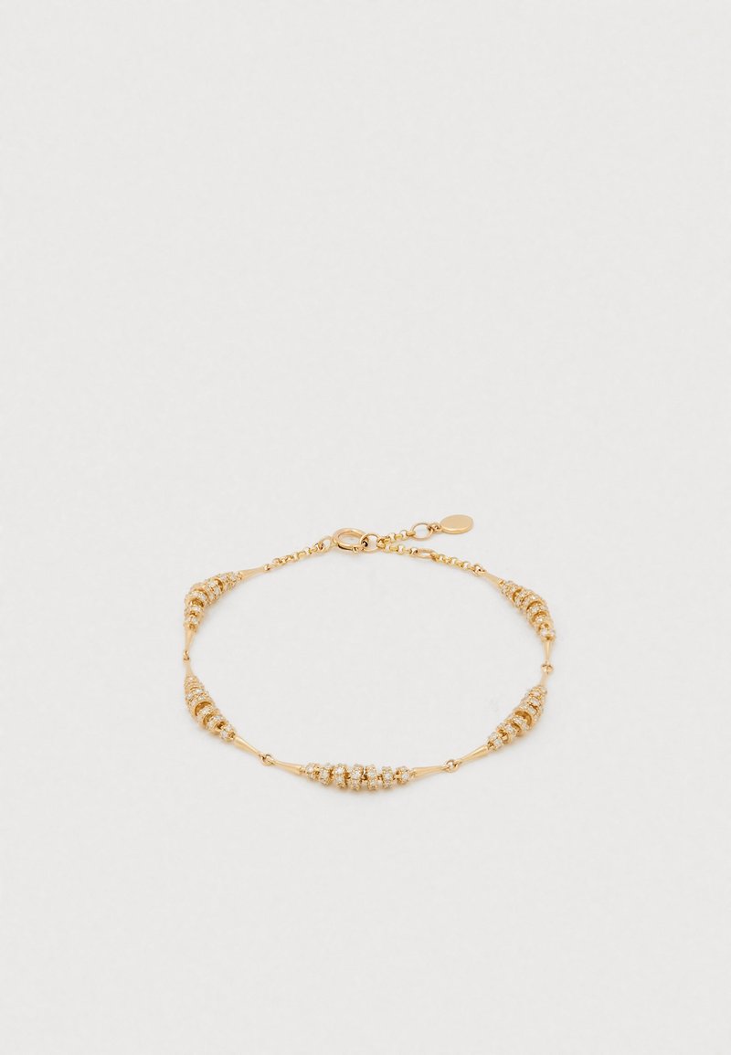 Brățară din aur cu bile alternante texturate și netede, fixată cu un închizător de tip homar, având un lanț delicat și lungime ajustabilă.