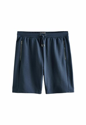 Marineblå knælange shorts med elastisk taljebånd, snøre og to lodrette lynlåslommer i siden, lagt fladt på hvid baggrund.