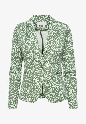 Grön kavaj med vitt sprickmönster, enfaldig knappstängning, utstickande slag och två framfickor. Tillverkad av ett strukturtyg.