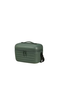 Étui rigide vert avec un dessus arrondi, surface texturée, fermeture à double zip et une sangle amovible pour le transport.