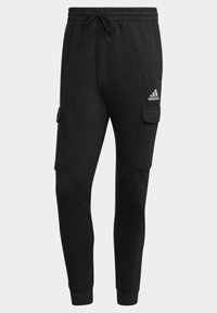 Sorte sweatpants med tapered fit, lavet af blødt stof, med to sidelommer, elastisk talje og et lille hvidt logo.
