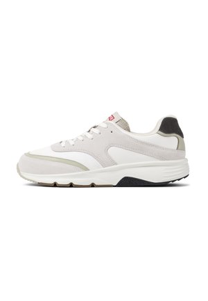 Light grey athletic shoe made of suede and mesh, featuring a white midsole, black outsole, and a subtle green accent on the design.