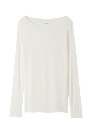 Haut à manches longues et col rond de couleur crème, fabriqué en tissu doux. Présente une coupe droite et un design minimaliste sans embellissements.