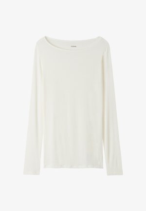 Top de manga larga y cuello redondo en color crema, hecho de una tela suave. Presenta un corte recto y un diseño minimalista sin adornos.