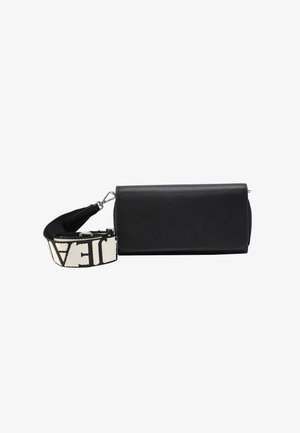 Black leather crossbody bag with textured surface, featuring a front logo and a removable fabric strap with a contrasting pattern.