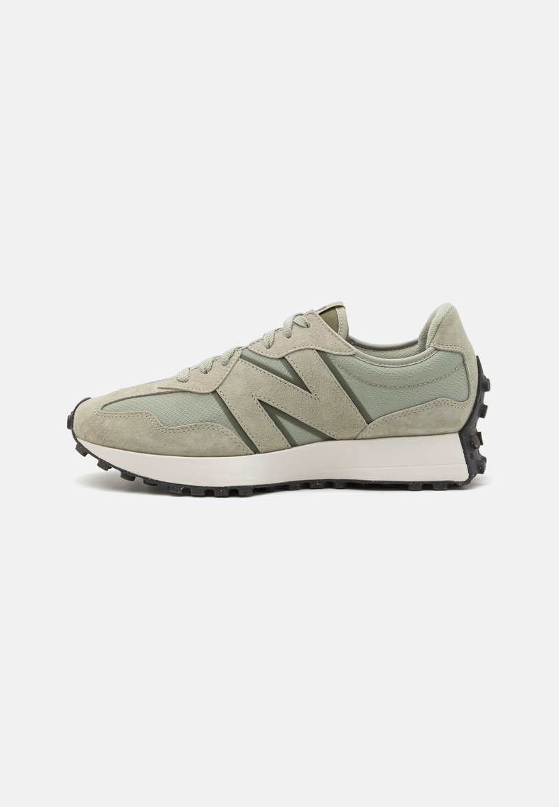 Green suede and mesh sneaker with a rounded toe, black rubber outsole, and prominent "N" logo. Designed for comfort and style.