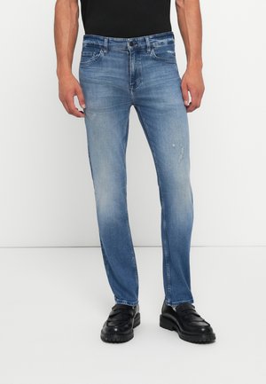 Blue denim jeans with a straight leg design, light wash, subtle distressing, five pockets, and standard button-and-zip closure.