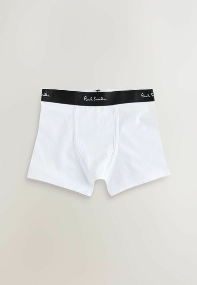Boxers pour hommes blancs avec une ceinture élastique noire portant le logo Paul Smith en écriture blanche.