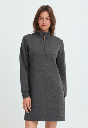 Dark gray zip-neck dress made of soft fabric with long sleeves. Features a half zip closure and a small logo accent near the hem.