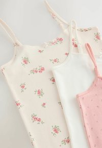 Three camisole tops in light colors: one cream with a floral pattern, one solid white, and one soft pink with small dots. Material is soft cotton.