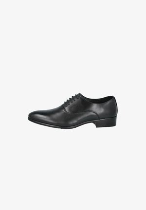 Zapato de vestir de cuero negro para hombre con cordones, punta puntiaguda y tacón bajo, mostrado de lado sobre fondo blanco.